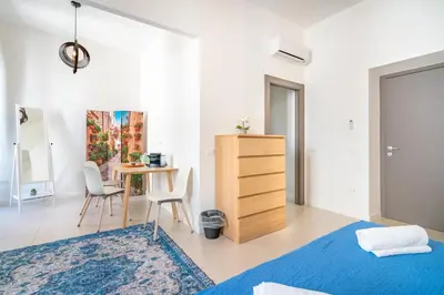 Letto o letti in una camera di Stanze Victoria in Marina