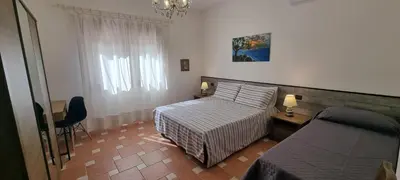 Letto o letti in una camera di Villa Virginia Porto Pino