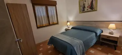 Letto o letti in una camera di Villa Virginia Porto Pino