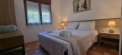 Letto o letti in una camera di Villa Virginia Porto Pino