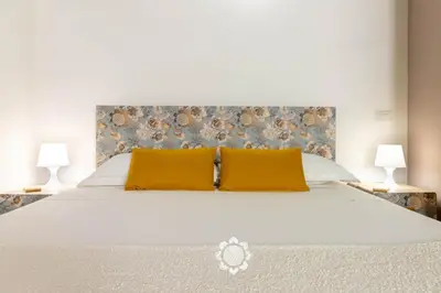 Letto o letti in una camera di Domus Ubaldina