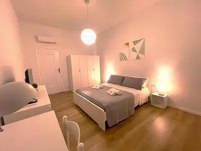 Letto o letti in una camera di Palazzo Tondo Apartment