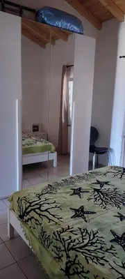 Letto o letti in una camera di Casa Adele