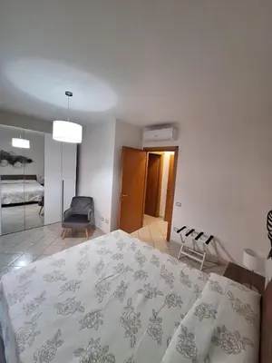 Letto o letti in una camera di CAGLIARI - Appartamento Asfodelo