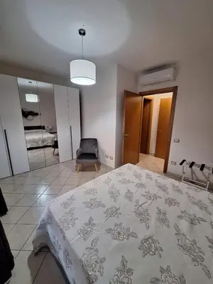 Letto o letti in una camera di CAGLIARI - Appartamento Asfodelo