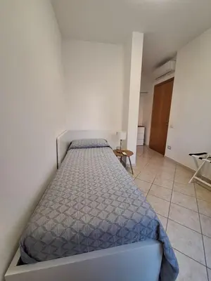 Letto o letti in una camera di CAGLIARI - Appartamento Asfodelo