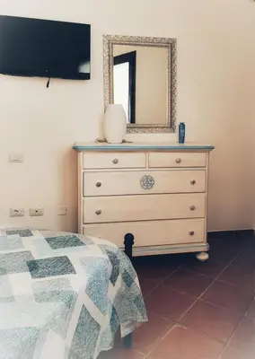 Letto o letti in una camera di Domu Abba&Chelu