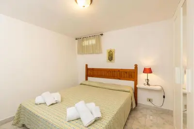 Letto o letti in una camera di Villetta l'Olivastro