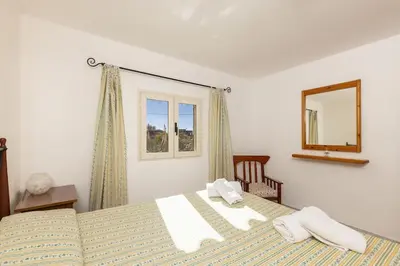 Letto o letti in una camera di Villetta l'Olivastro