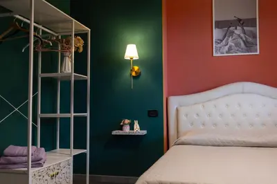 Letto o letti in una camera di XiHouse Bed & Apartments - Iglesias