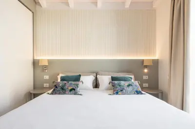 Letto o letti in una camera di Karalin Sonnino Suites