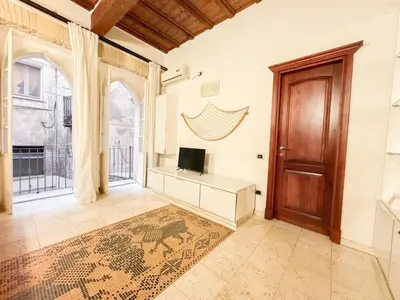 TV o dispositivi per l'intrattenimento presso Kalma Via Manno - Central Stay with Stone Walls & Private Cinema