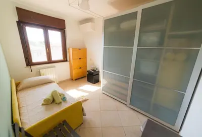 Letto o letti in una camera di guest house La Vernaccia