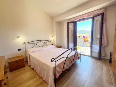 Letto o letti in una camera di Appartamento il Lentischio a 5 minuti dal mare con Aria Condizionata