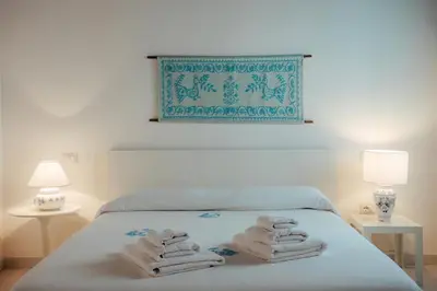 Letto o letti in una camera di Casa Giunicchi, un gioiello fronte mare