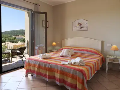 Letto o letti in una camera di B&B I Colori di Chia