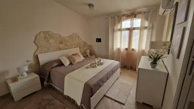 Letto o letti in una camera di La casa delle rose 3