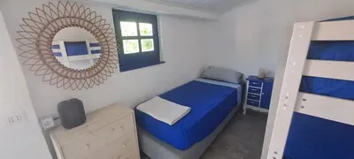 Letto o letti in una camera di -Giardino- Vakantiehuis tussen de olijvenbomen