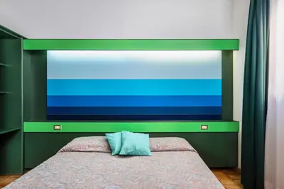 Letto o letti in una camera di ISA-Ecovillage with swimming-pool in Teulada surrounded by greenery just 400 meters from the sea