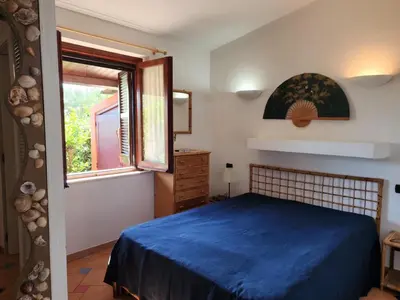 Letto o letti in una camera di Villetta Sunrise 66