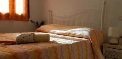 Letto o letti in una camera di Il Girasole