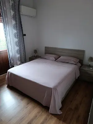 Letto o letti in una camera di Piccolo ma funzionale