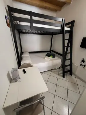Letto o letti in una camera di La piccola casetta nel centro storico