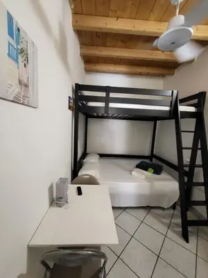 Letto o letti in una camera di La piccola casetta nel centro storico