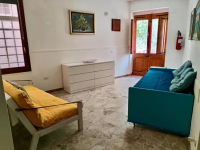 Area soggiorno di Residenza Le Scalette - Appartamento piano terra con affaccio primo piano
