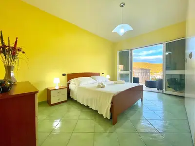 Letto o letti in una camera di Sunrise Apartments