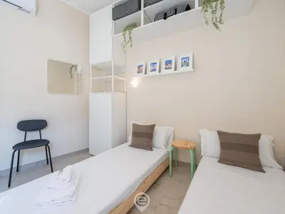 Letto o letti in una camera di Artful Modern Escape