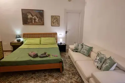 Letto o letti in una camera di karalis Apartment2garden