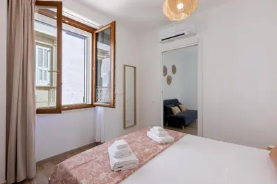 Letto o letti in una camera di GuestHost - Two ApartmentS in Centre of Carloforte!