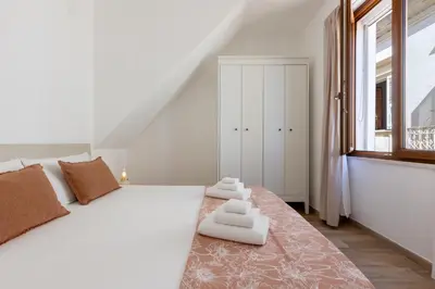 Letto o letti in una camera di GuestHost - Two ApartmentS in Centre of Carloforte!