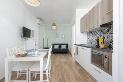 Cucina o angolo cottura di GuestHost - Two ApartmentS in Centre of Carloforte!
