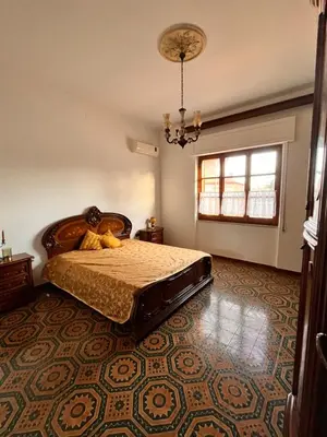 Letto o letti in una camera di Casa dei nonni