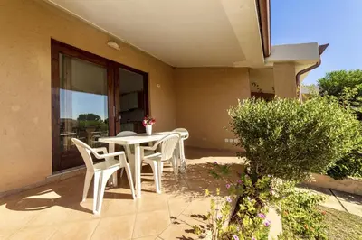 Balcone o terrazza di Village in Porto Corallo just 200 meters from the beach, apartments with private outdoor area