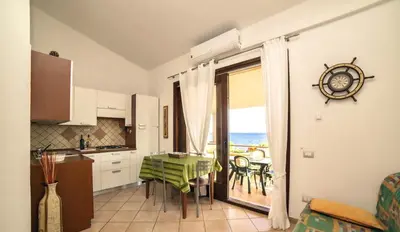 Cucina o angolo cottura di ISA-Village in Porto Corallo just 200 meters from the sea, apartments with private outdoor area