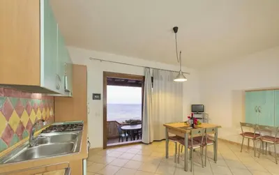 Cucina o angolo cottura di ISA-Villas in Porto Corallo just 400 meters from the sea