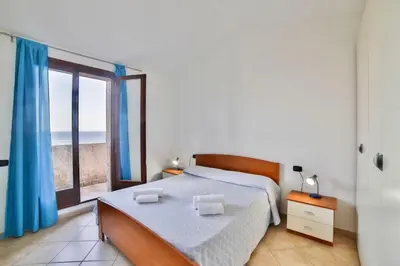 Letto o letti in una camera di ISA-Villas in Porto Corallo just 400 meters from the sea