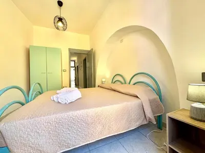 Letto o letti in una camera di La Corte Bari Sardo