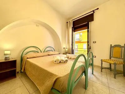 Letto o letti in una camera di La Corte Bari Sardo