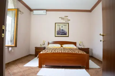 Letto o letti in una camera di CasaFlo - Cabras