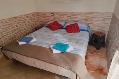 Letto o letti in una camera di Flowers House Appartamento a Quartu S Elena