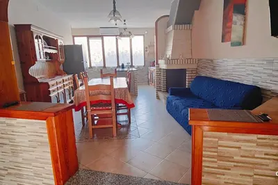 Area soggiorno di Flowers House Appartamento a Quartu S Elena