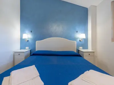 Letto o letti in una camera di Casa Vacanze Airone