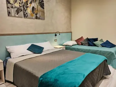 Letto o letti in una camera di Le Nonne HOUSE - Assemini - free parking