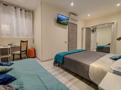 Letto o letti in una camera di Le Nonne HOUSE - Assemini - free parking