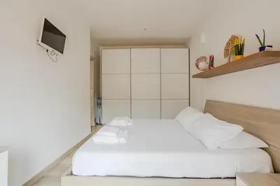 Letto o letti in una camera di Marina Centro città in pieno centro storico