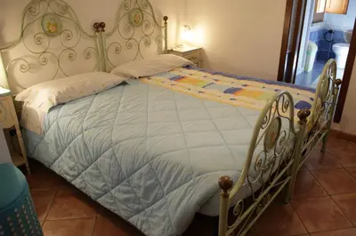 Letto o letti in una camera di Su Livariu